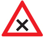 White triangle sign with red border and black cross in the middle.